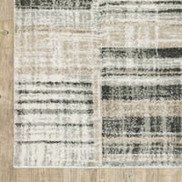 6' X 9' Grey Charcoal Ivory Tan Brown And Beige Geometric Power Loom Stain Resistant Area Rug