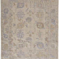 5' X 8' Tan Orange And Blue Floral Hand Knotted Stain Resistant Area Rug