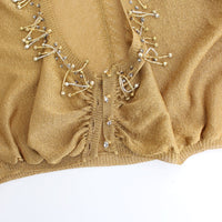 Gold embellished gold shrug