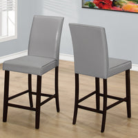 Two 40" Grey Leather Look, Solid Wood, and MDF Counter Height Dining Chairs