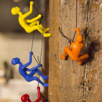 6" x 3" x 3" Resin Orange Climbing Man