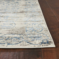 7'x10' Ivory Blue Machine Woven Distressed Traditional Indoor Area Rug