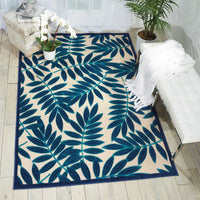 8’ x 11’ Navy and Beige Leaves Indoor Outdoor Area Rug