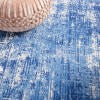 5’ x 7’ Blue and Ivory Abstract Splash Area Rug