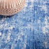 6’ x 9’ Blue and Ivory Abstract Splash Area Rug