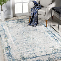 8’ x 11’ Ivory and Blue Abstract Distressed Area Rug