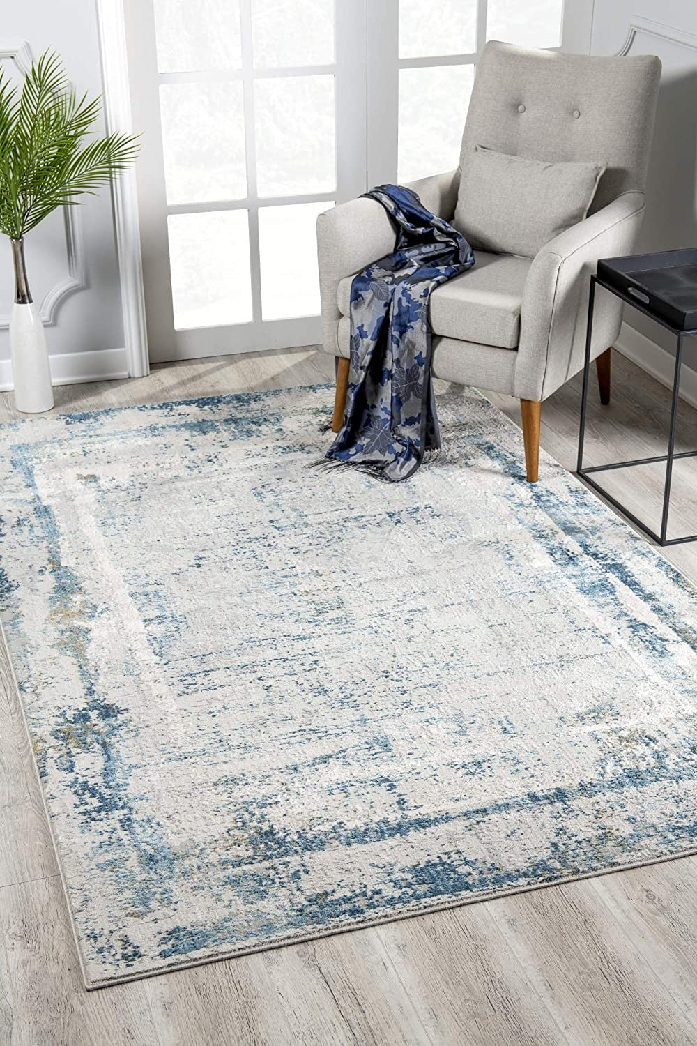 8’ x 11’ Ivory and Blue Abstract Distressed Area Rug