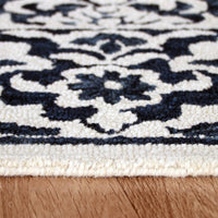 7’ x 9’ Blue and Ivory Decorative Area Rug