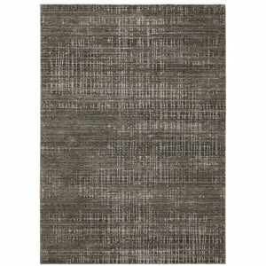 6' X 9' Charcoal Grey Grey Ivory Tan And Brown Abstract Power Loom Stain Resistant Area Rug